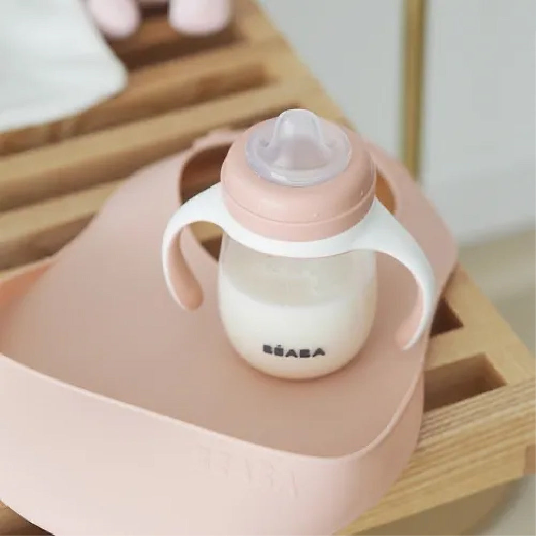Biberon rose avec poignées pour bébé, idéal pour l'allaitement et le bien-être maternel